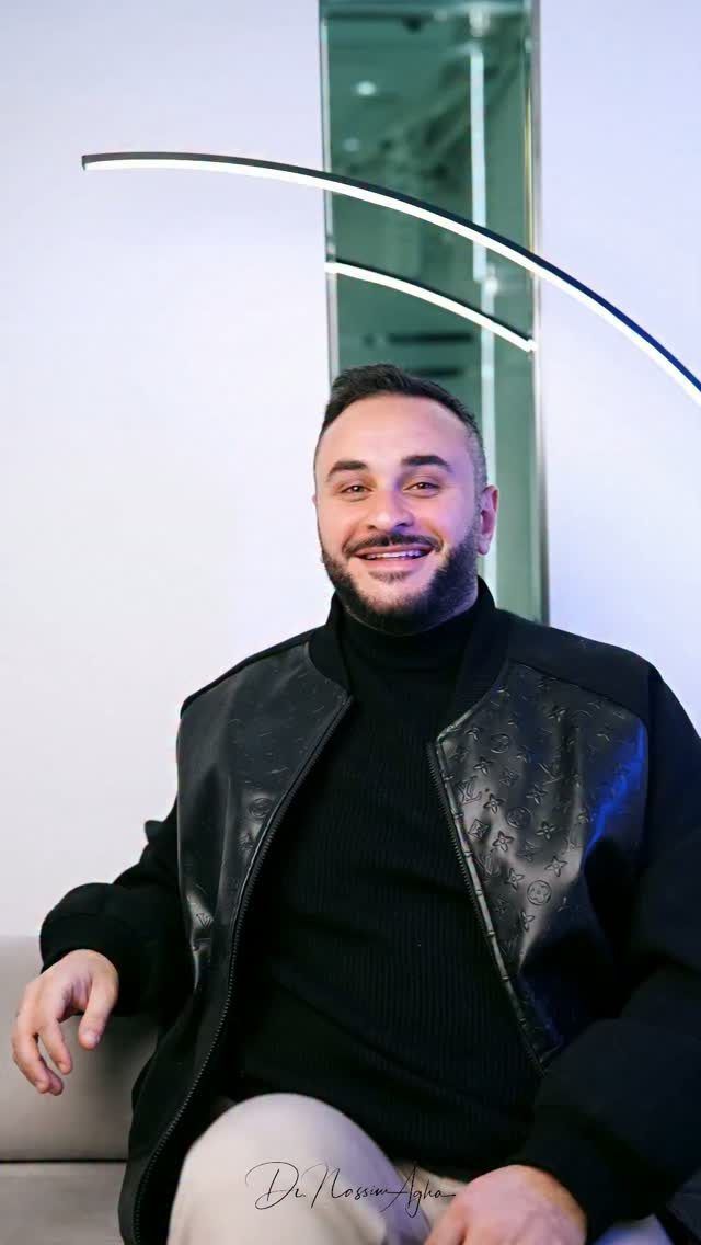 A patient of the clinic smiling in the waiting area