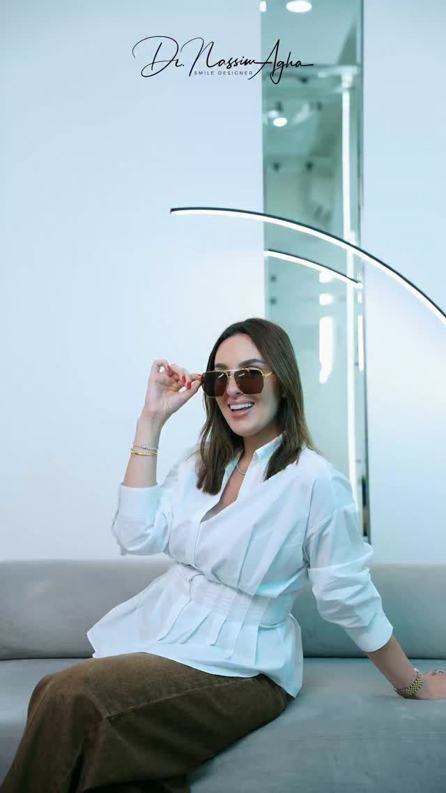 A patient of the clinic smiling in the waiting area